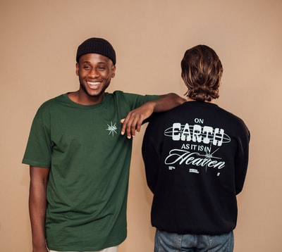 Wear green round collar T-shirt and a man wear black round collar T-shirt woman together
